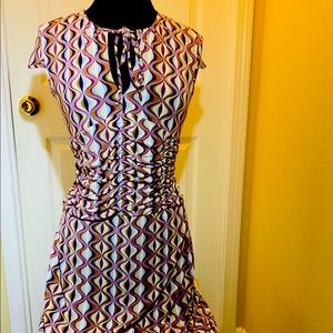 Cap sleeve dress with self tie round neckline. Rushing in the front size S